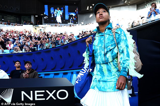 The Japanese tennis star turned heads as she entered Rod Laver Arena wearing a long turquoise 'jellyfish'-inspired tunic