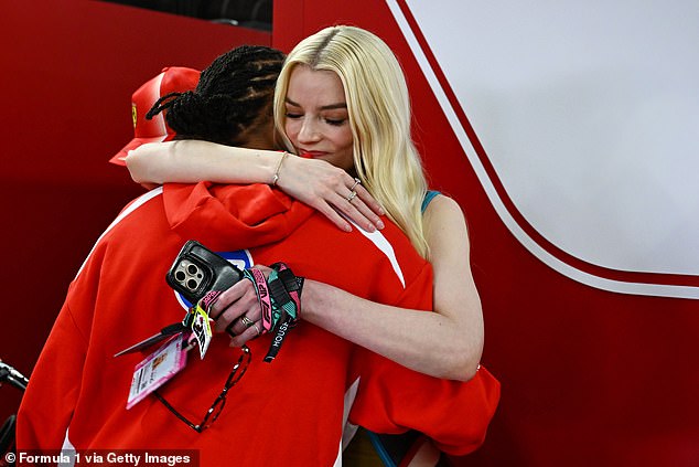 The Ferrari driver shared a tender embrace with the British actress ahead of the big race