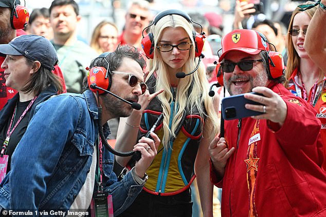 And they looked delighted to be on a real-life racing track, snapping a number of selfies together as Lewis showed them around the Ferrari garage ahead of the big race