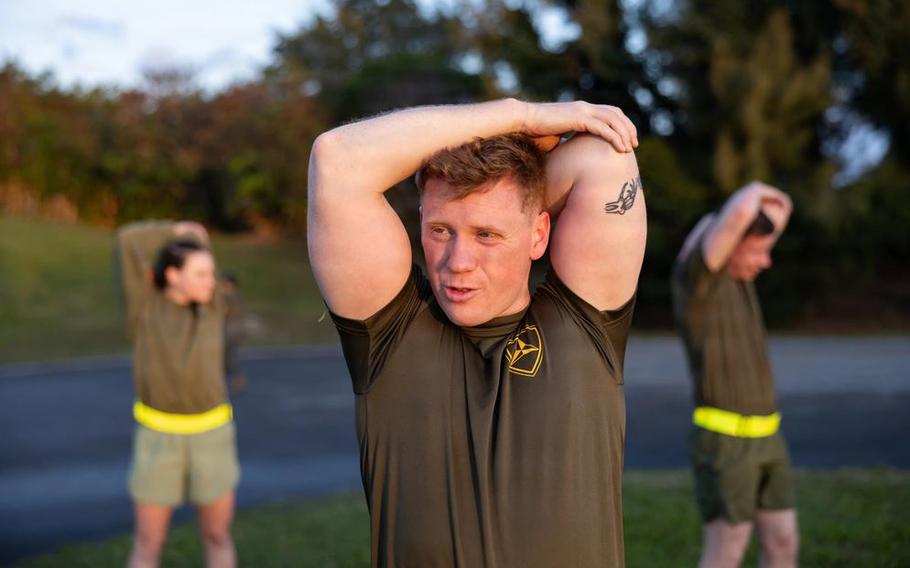 U.S. Marine Corps Capt. Brennen Yancey stretches in a physical training session on Camp Courtney, Okinawa, Japan.