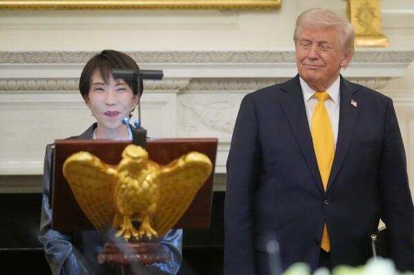 Japan's Prime Minister Sanae Takaichi speaks during a dinner with President Donald Trump in the State Dining Room of the White House, Thursday, March 19, 2026, in Washington. (AP Photo/Julia Demaree Nikhinson)