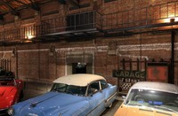 Inside the Chikko Red Brick Warehouse, now used as a classic car exhibition space, a white line remains on the walls marking where the second floor used to be, as seen in the city of Osaka's Minato Ward, Feb. 19, 2026. (Mainichi/Masashi Mimura)