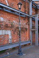 A wall of the Chikko Red Brick Warehouse's south wing, now used as a parking lot and event space, is seen in the city of Osaka's Minato Ward, Feb. 19, 2026. The　steel frames have been added for earthquake resistance. (Mainichi/Masashi Mimura)