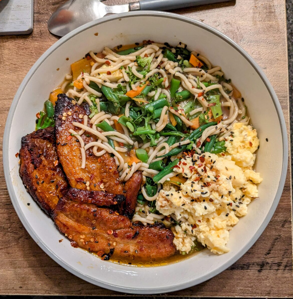 My first attempt at making homemade ramen - pork belly, vegetables, and SCRAMBLED egg.