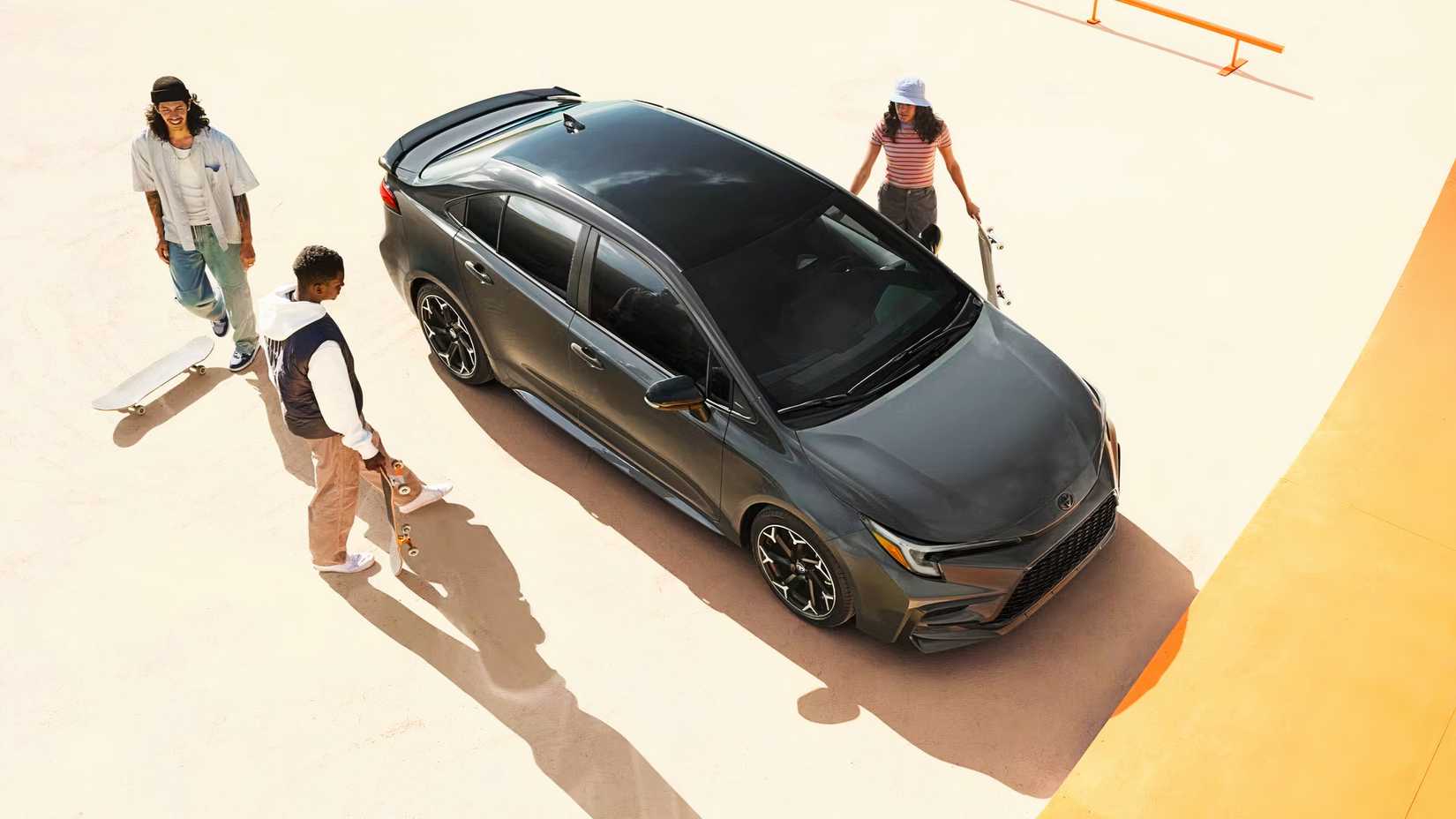 A gray 2025 Toyota Corolla Hybrid at a skate park.