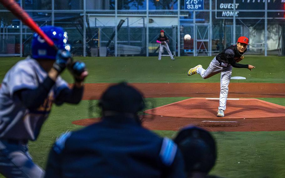 Taisai Shimakura throw a pitch toward home plate.