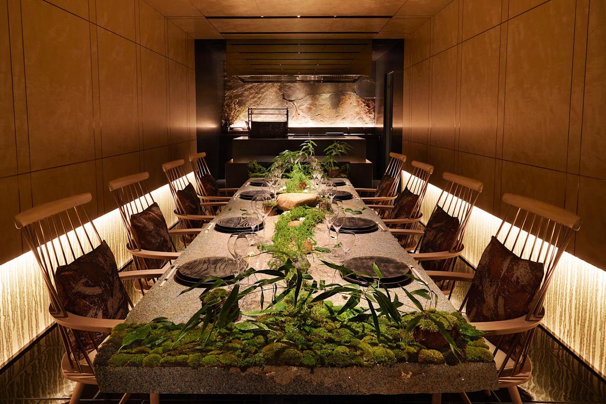 a table set for eight at a japanese style restaurant