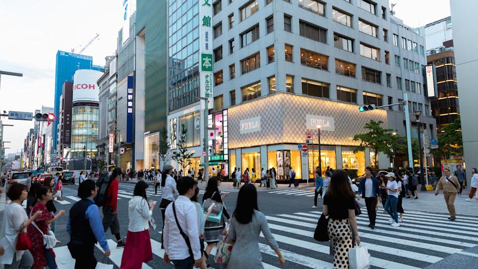 TOKYO, JAPAN - MAY 11: Undefined Japanese and Foreign tourists are Walking across the crosswalk around Ginza Wako and Ginza Mitsukoshi upmarket on May 11, 2019, Tokyo, Japan.