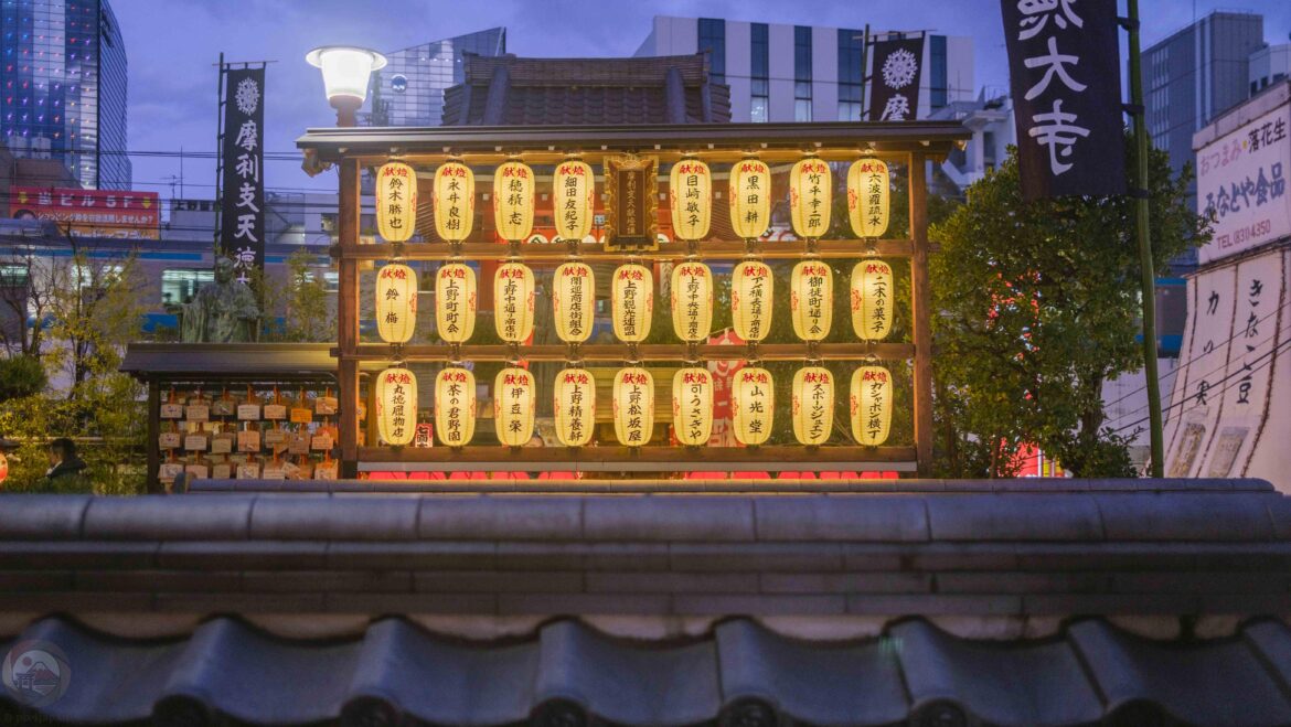 Lanterns and Ema Overlooking a Passing Train in Ueno, Tokyo