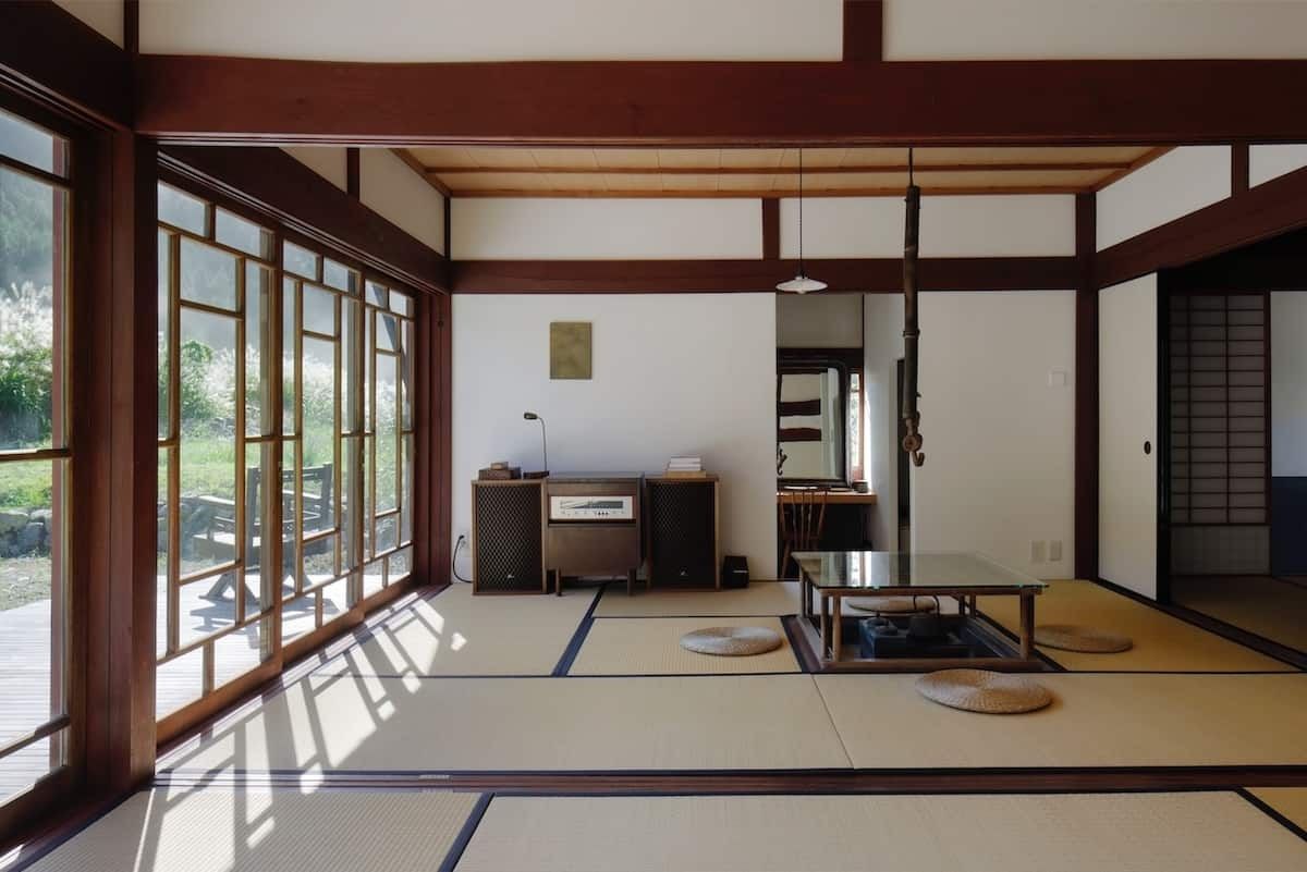 Image may contain Indoors Interior Design Floor Lamp Architecture Building Furniture Living Room and Room