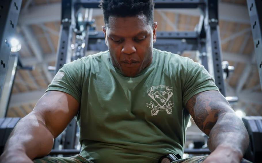 U.S. Marine Corps Maj. Enrique Marris, U.S. Forces Japan J5, concentrates before attempting his maximum bench press during the monthly Samurai Challenge at Yokota Air Base, Japan.
