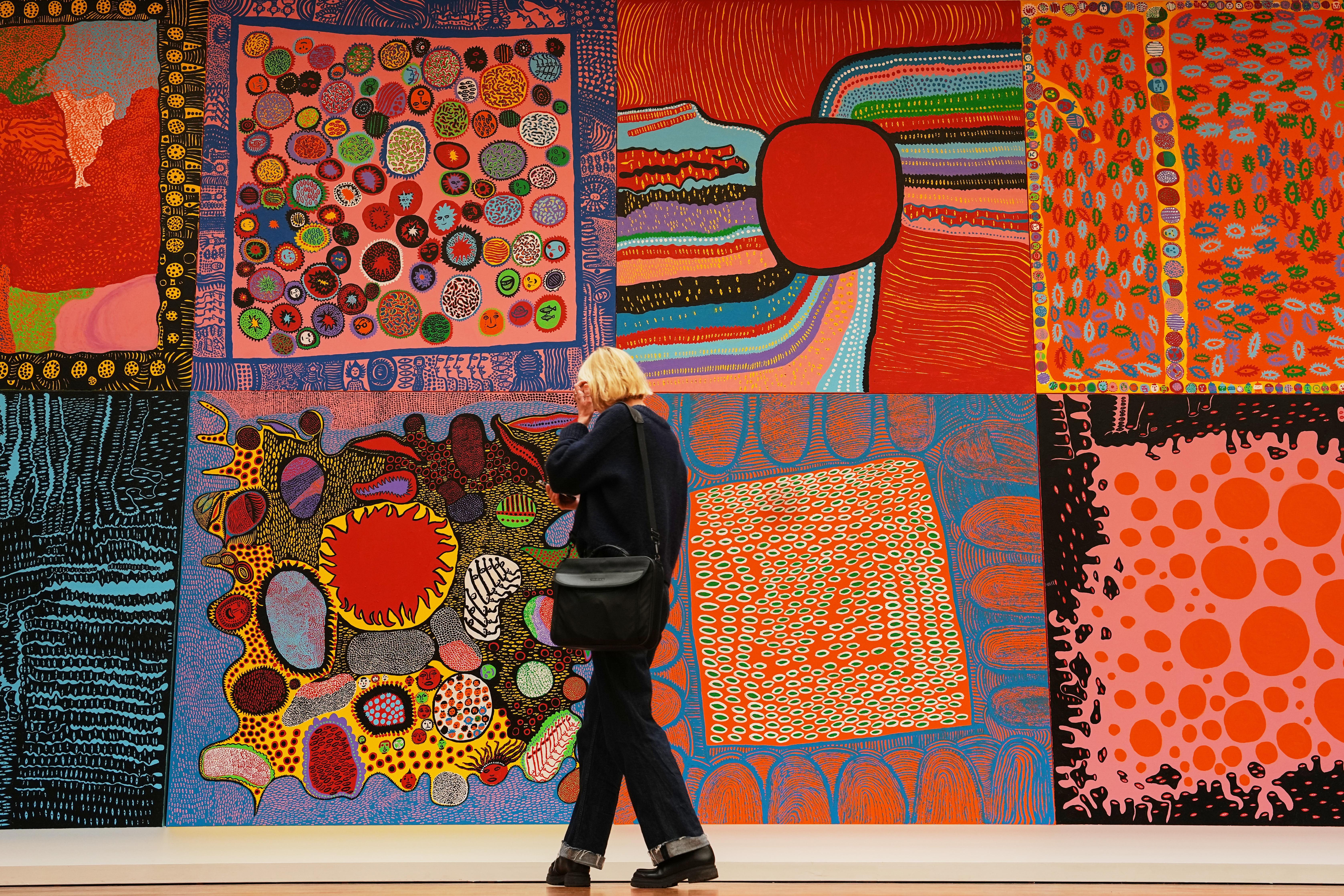 A woman views the artwork ‘My Eternal Soul Series’ during...