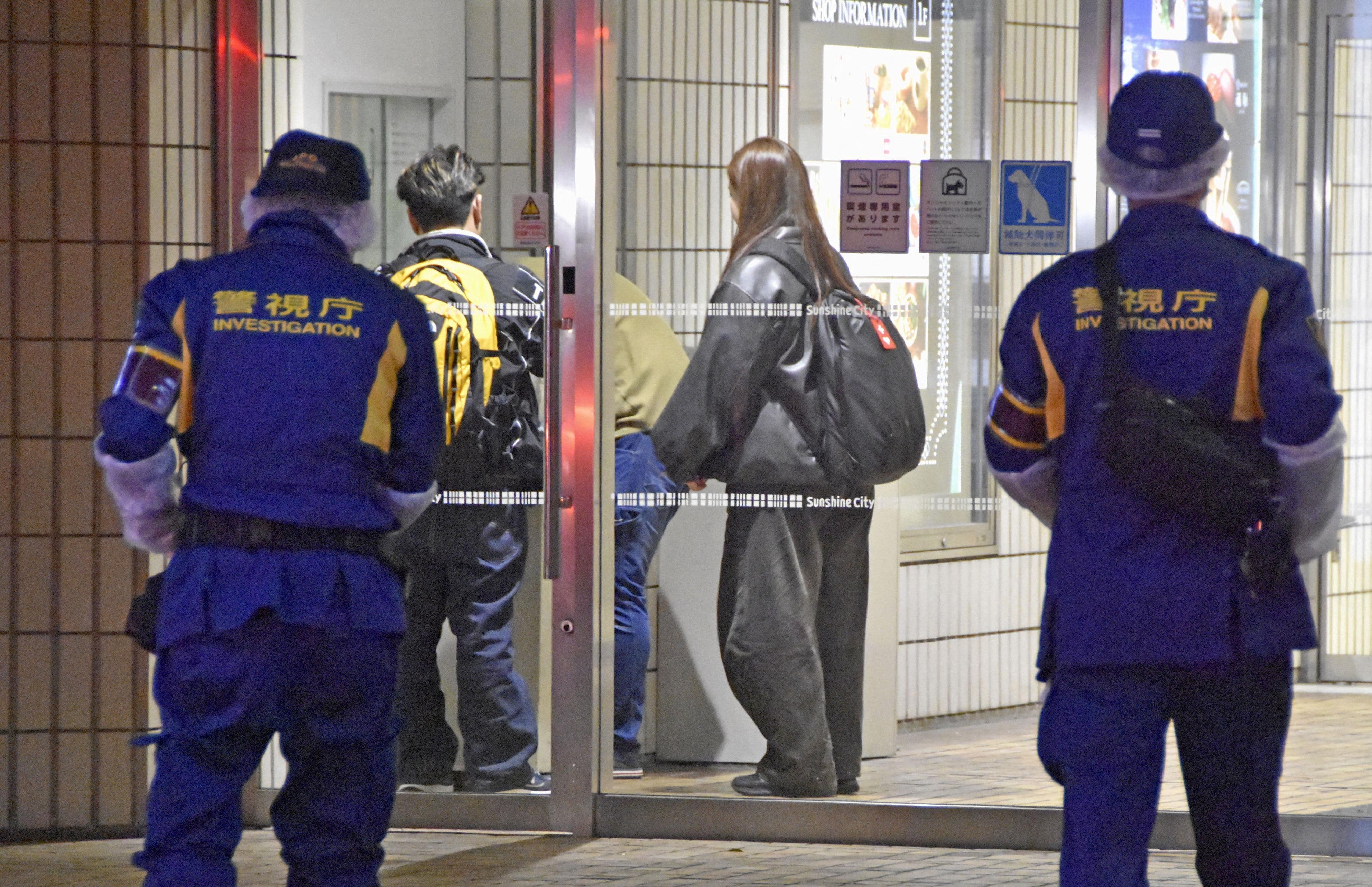 Police on the scene after the young Pokémon store worker was stabbed to death