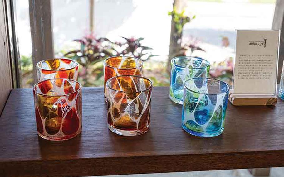 Some glasses are displayed on a shelf.