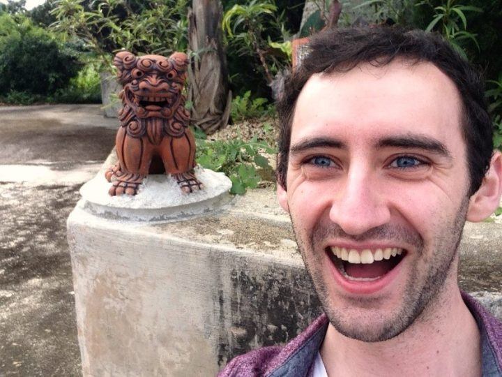 Toby posing with a shisa statue in Inshigaki, Yaeyama islands, Japan
