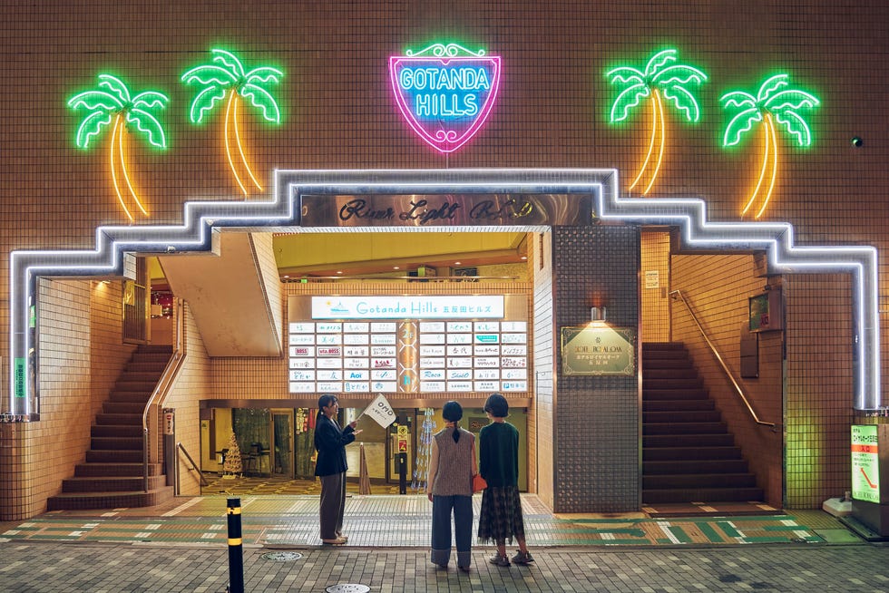 entrance to gotanda hills with neon palm tree decorations entrance to gotanda hills with neon palm tree decorations