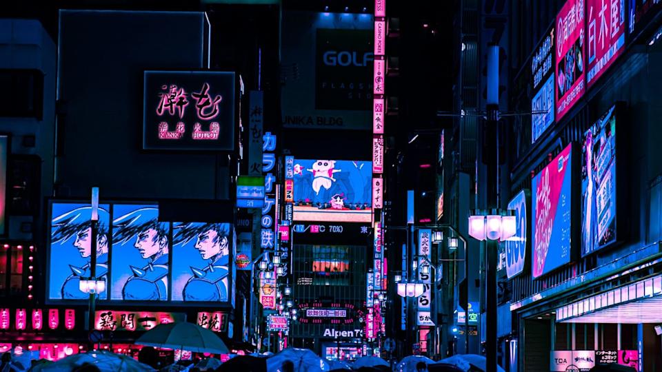 Tokyo, Japan - 05.2022: Abstract Pedestrian with Neon light from billboards and advertisement in nightlife district of Kabukicho, Shinjuku, Japan. Nightlife, Futuristic metaverse city, and cyberpunk.