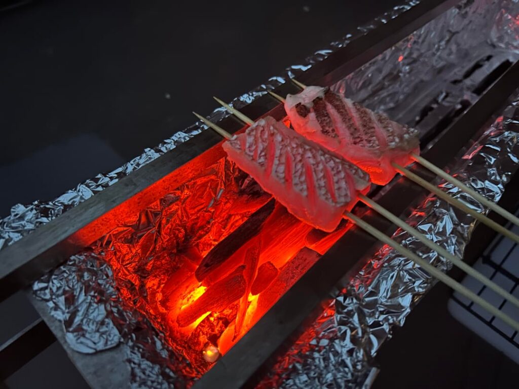 Grilling up some Red Snapper over binchotan Grilling up some Red Snapper over binchotan
