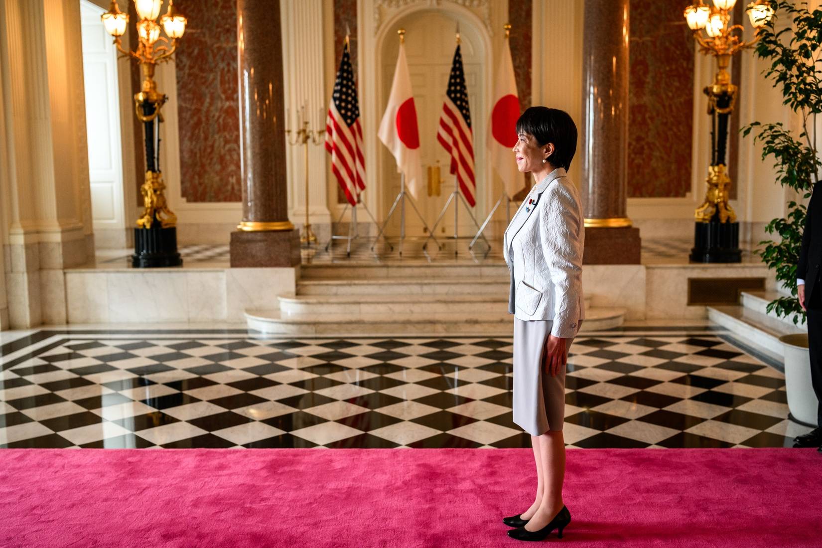 Japanese Prime Minister Sanae Takaichi standing in Akasaka Palace in Tokyo, Japan.