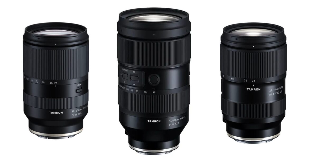 Three black Tamron camera lenses are displayed upright against a white background, showing different sizes and focal length markings on their barrels.