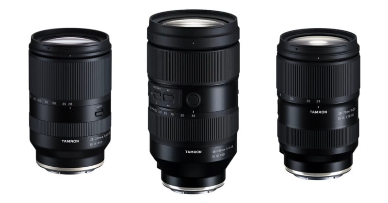 Three black Tamron camera lenses are displayed upright against a white background, showing different sizes and focal length markings on their barrels.