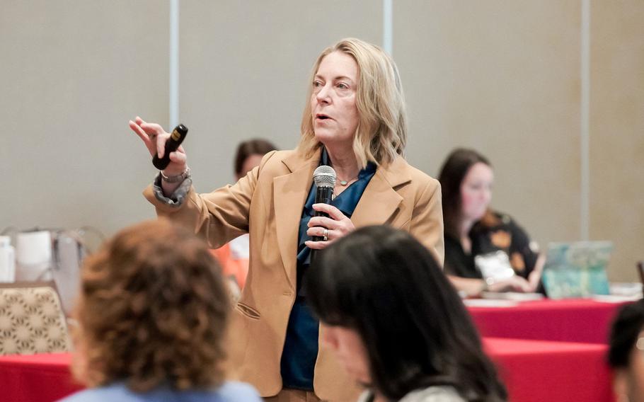Carole Turner, wife of Lt. Gen. Roger Turner, commander of the III Marine Expeditionary Force, speaks to military spouses during the Okinawa Leadership Seminar at the Rocker Enlisted Club on Kadena Air Base, Okinawa, May 7, 2025.