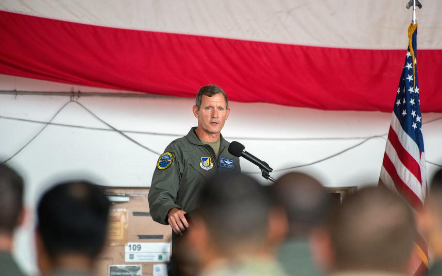 Brig. Gen. John Gallemore stands at a podium next to an American flag.