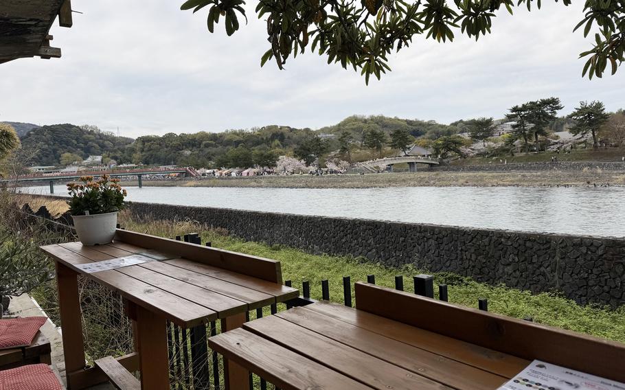 Riverside tables offer a shady view of the waterway.