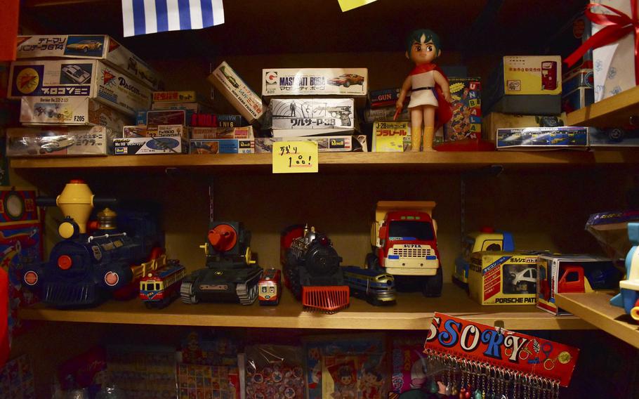 Antique toys sit on shelves.
