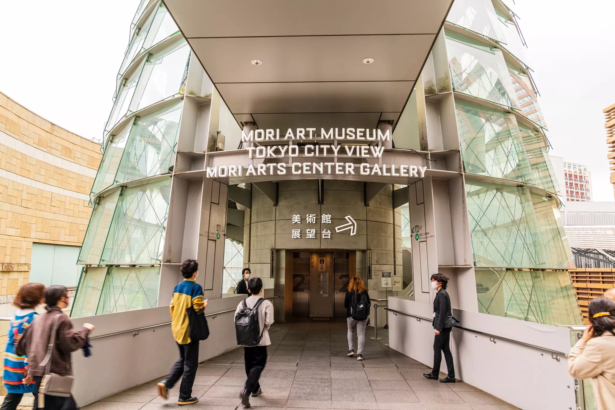 Visitors at the entrance to the Mori Art Museum in Tokyo, Japan.