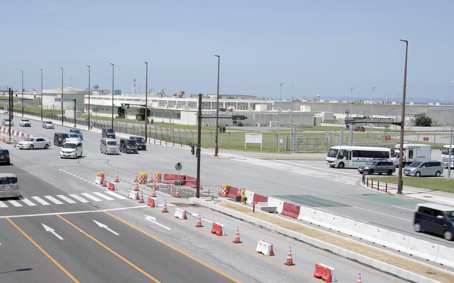 Cars drives through the Route 58 intersection near Camp Kinser’s Gate 2 in Urasoe city, Okinawa.