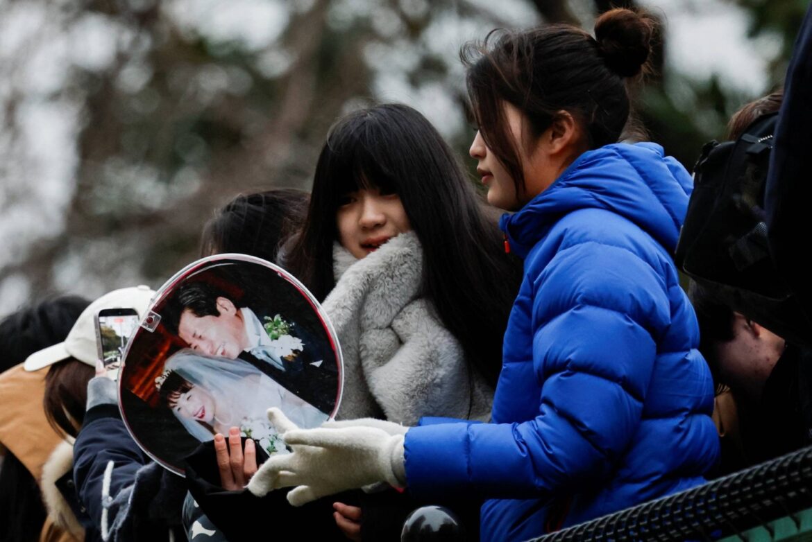 Debt-laden Japan should review spending on gender equality, survey finds