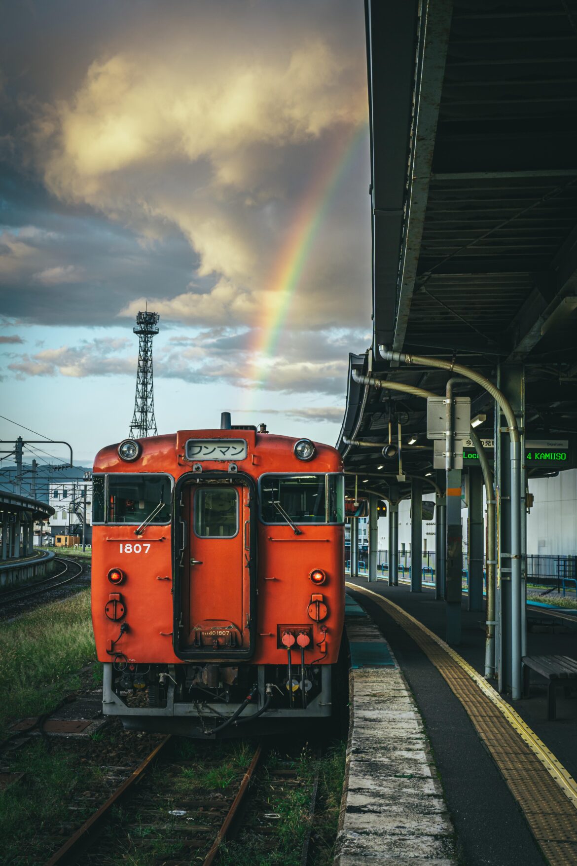 A rainbow over a local KiHa 40 train at Hakodate Station, Hokkaido.