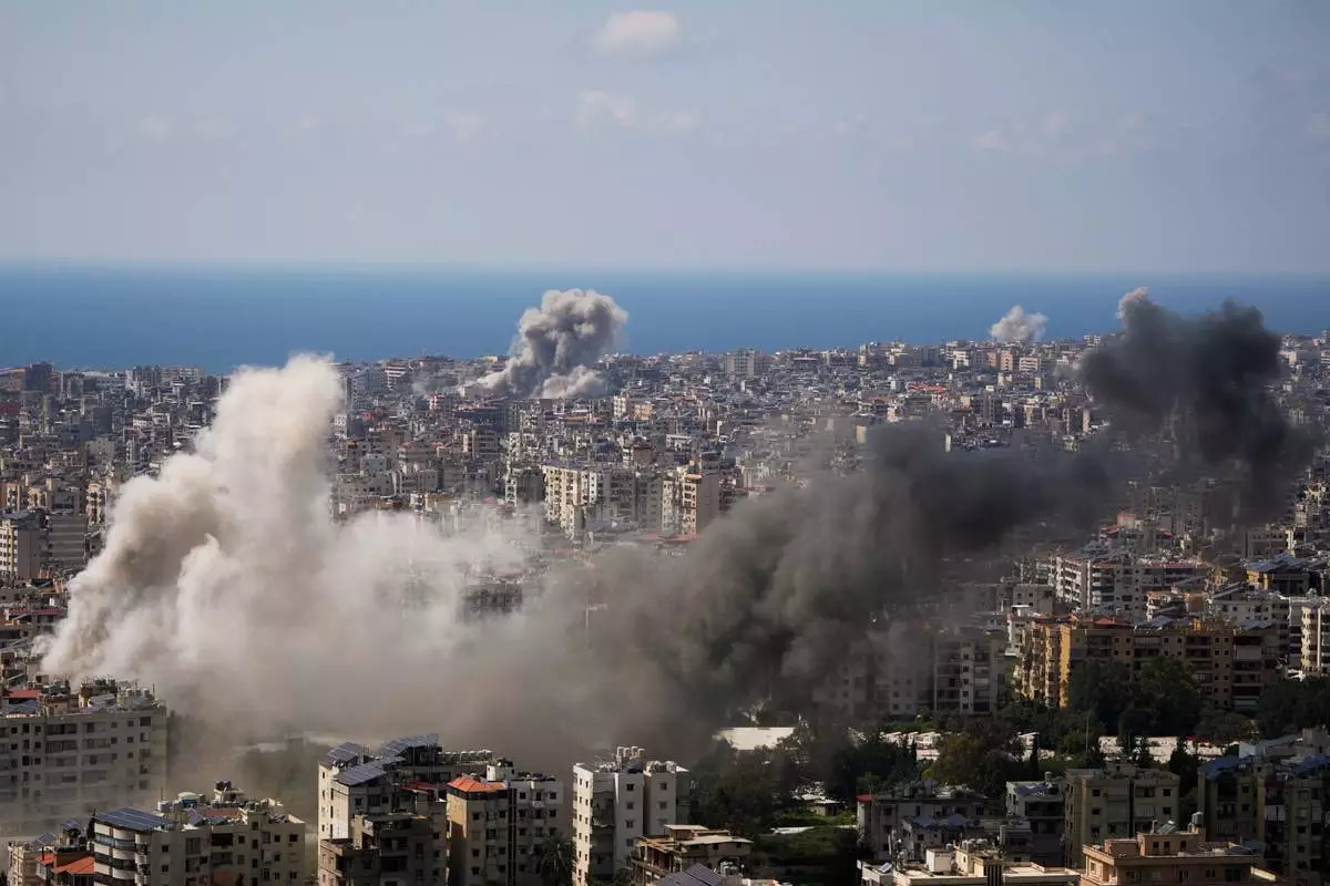 Smoke rises following several Israeli airstrikes in Beirut, Lebanon, Wednesday, April 8, 2026. (AP Photo/Hassan Ammar)