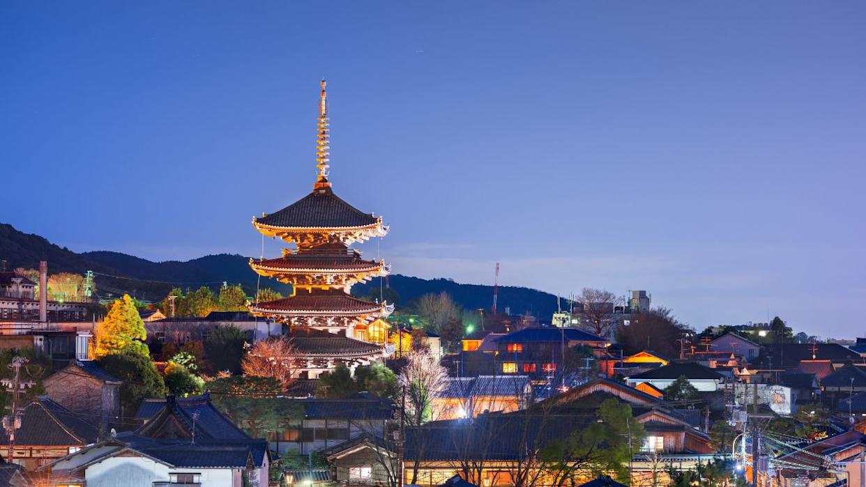 Kyoto rooftop cityscape in the Higashiyama historic district at night.