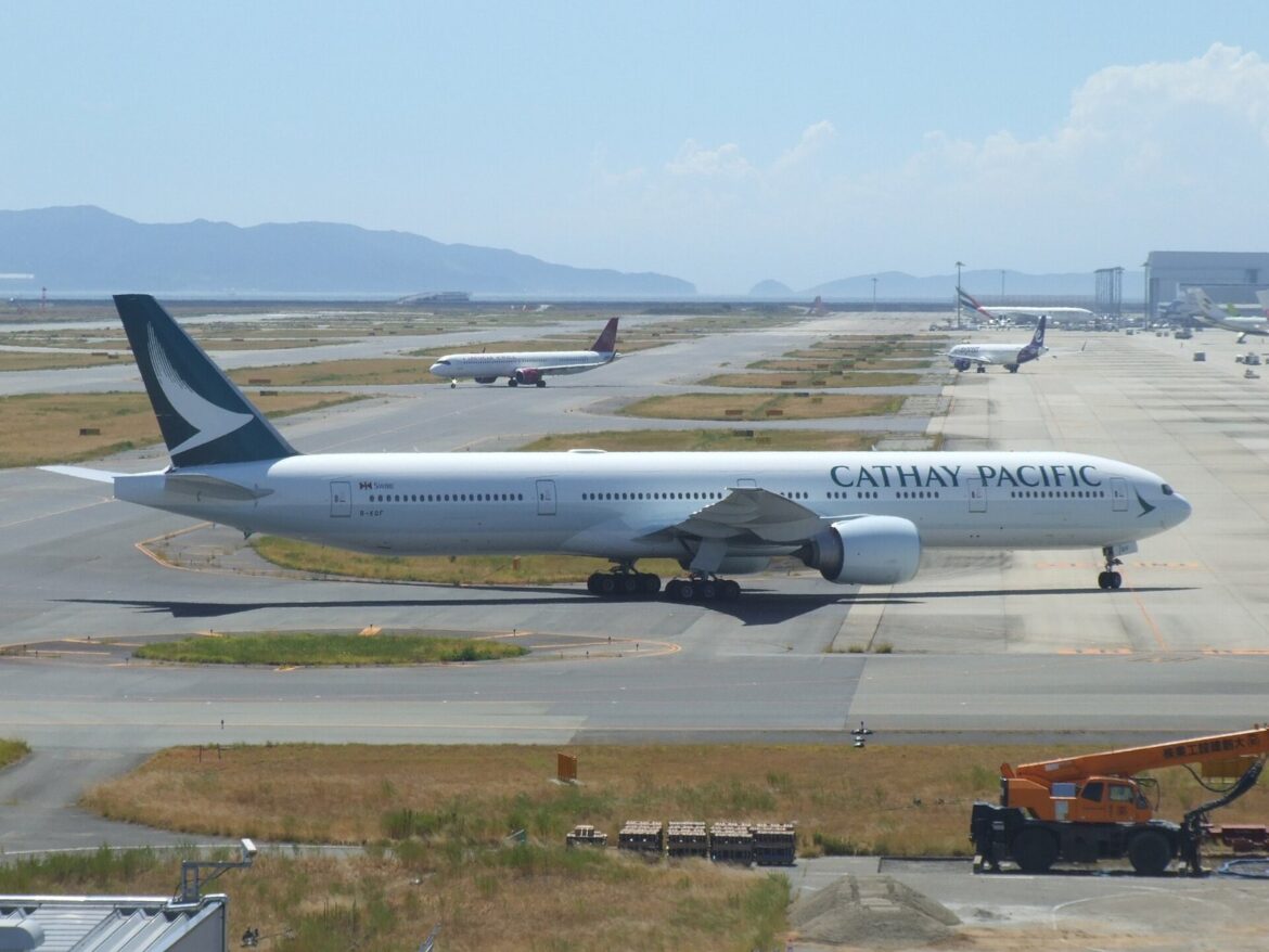 Osaka, Japan: A long-haul flight operated by Cathay Pacific diverted to Japan on April 7 after the crew detected an abnormal engine indication while en route from Los Angeles to Hong Kong, triggering a precautionary emergency response. Flight CX883, operated by a Boeing 777-300ER, was carrying 370 passengers and crew when cockpit systems indicated a drop in engine oil levels during cruise over the Pacific Ocean. Such alerts are treated with high priority in commercial aviation due to their potential implications for engine performance and long-range flight safety. The flight crew initiated standard emergency protocols and diverted the aircraft to Kansai International Airport, one of the nearest suitable diversion airports capable of handling widebody operations. The aircraft landed safely at approximately 4:30 a.m. local time. No injuries were reported, and passengers disembarked normally. In a statement, Cathay Pacific said the diversion was conducted “in accordance with established safety procedures,” emphasizing that safety remains its top operational priority. The airline confirmed that the aircraft has been withdrawn from service pending a comprehensive technical inspection by engineering teams to determine the cause of the engine oil indication. The airline arranged alternative flights to Hong Kong, but the sudden influx of disrupted passengers placed pressure on ground handling resources at Kansai. The incident caused minor delays to another flight at Kansai International Airport due to the emergency landing. Cathay Pacific has initiated a technical investigation into the incident. Engineers will examine the affected engine system, review flight data, and determine whether the issue stemmed from a mechanical fault, sensor anomaly, or other contributing factors.