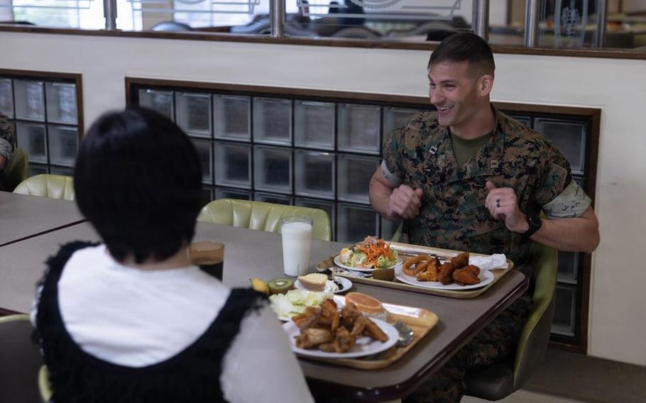 U.S. Marine Corps Capt. Brett Vannier, communication strategy and operations director with 3rd Marine Logistics Group, speaks with students from Kushiro-Hokuyo High School, Hokkaido.