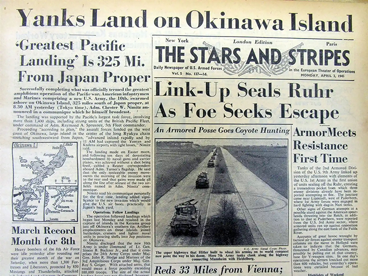 This lead image for the article is a photograph of a yellowing newspaper front page. It carries the masthead “The Stars and Stripes.” Extending across its top, in large lettering, reads the headline, “Yanks Land on Okinawa Island.” Below is the deck: “‘Greatest Pacific Landing’ Is 325 Mi. From Japan Proper.” The story follows below, accompanied by a graphic illustrating the island with an arrow indicating the landing site. This image is the first in a series of six accompanying the article. 