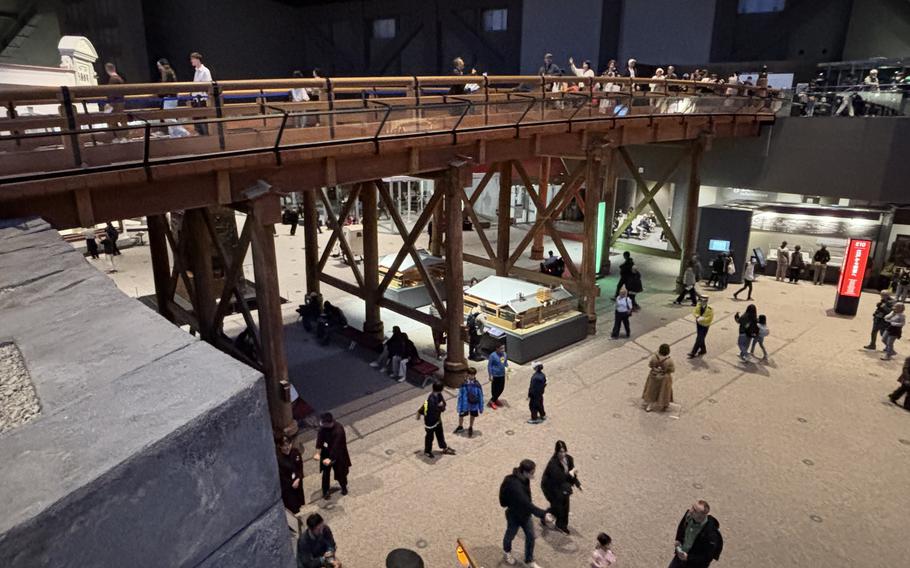 Visitors walk on and under the bridge.