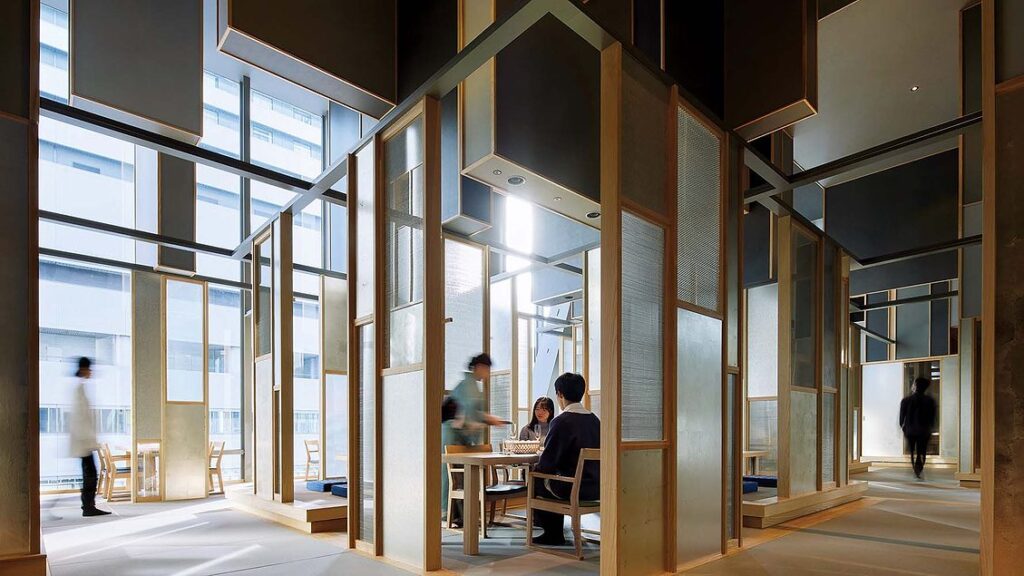 An Elaborate Array of Wood and Aluminum-Mesh Panels Fills a Soaring Eatery in Osaka