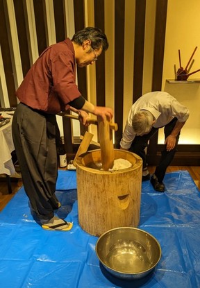 Mochitsuki, pounding rice into mochi with a wooden mallet in Kiso-Fukushima.