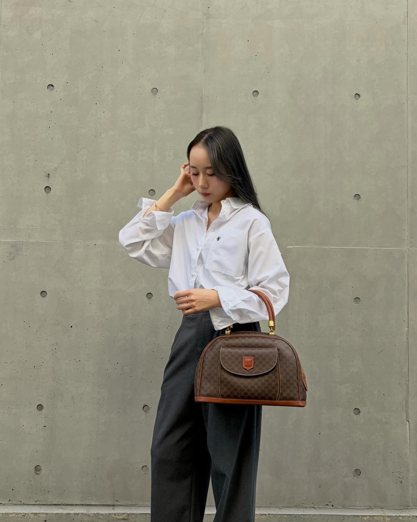 Woman wearing best vintage designer back from Tokyo.