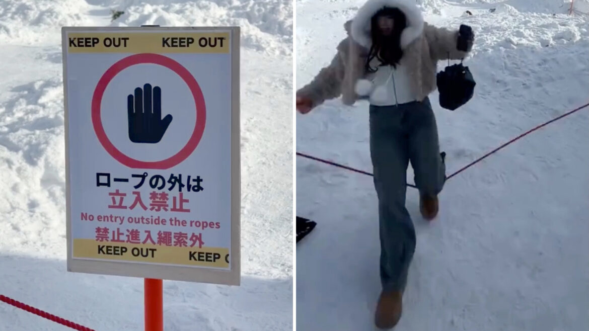 A woman in a winter outfit walks near a "Keep Out" sign on a snowy landscape.