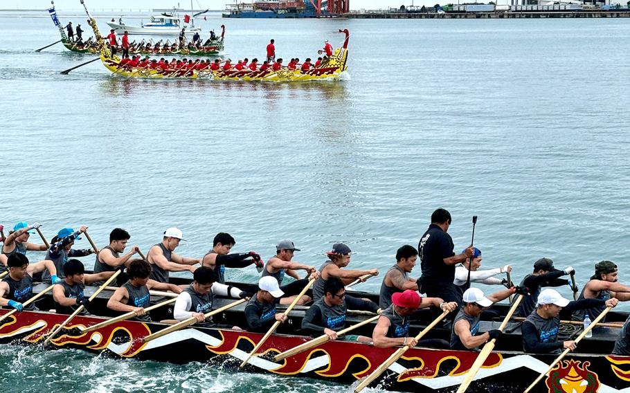 People rowing a boat during Naha Dragon Boat Race.