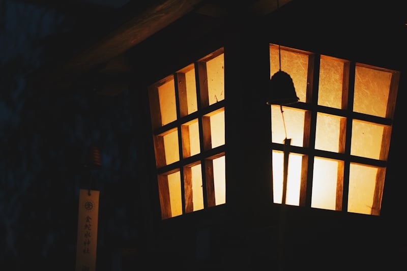 Window at Kanahebisui Shrine lit at night