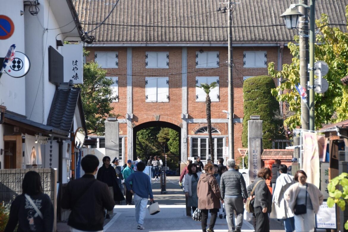 visitors-approach-the-main-gate-of-tomioka-silk-mill.jpeg