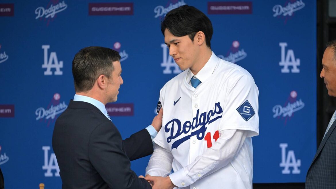 Fans might be overlooking key detail with Dodgers’ next possible Japanese target Jan 22, 2025; Los Angeles, CA, USA; Andrew Friedman, President of baseball operations shakes hands with Los Angeles Dodgers pitcher Roki Sasaki (11) during a press conference at Dodger Stadium. Mandatory Credit: Jayne Kamin-Oncea-Imagn Images