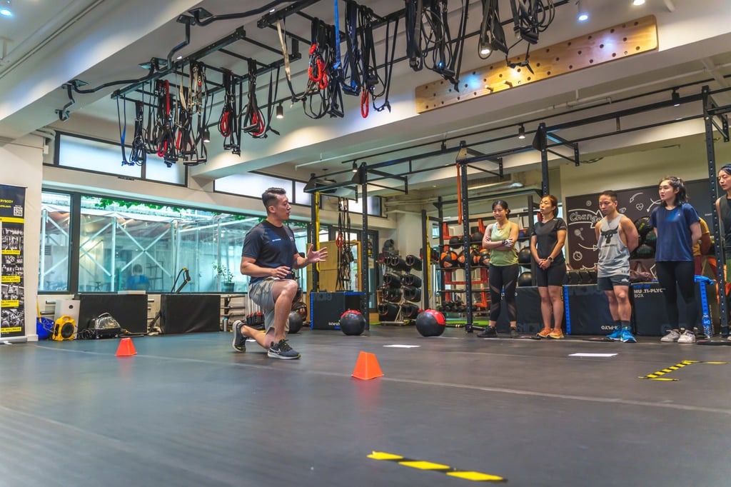 A coach takes racers through training for Hyrox workouts. Photo: Gayatri Bhaumik