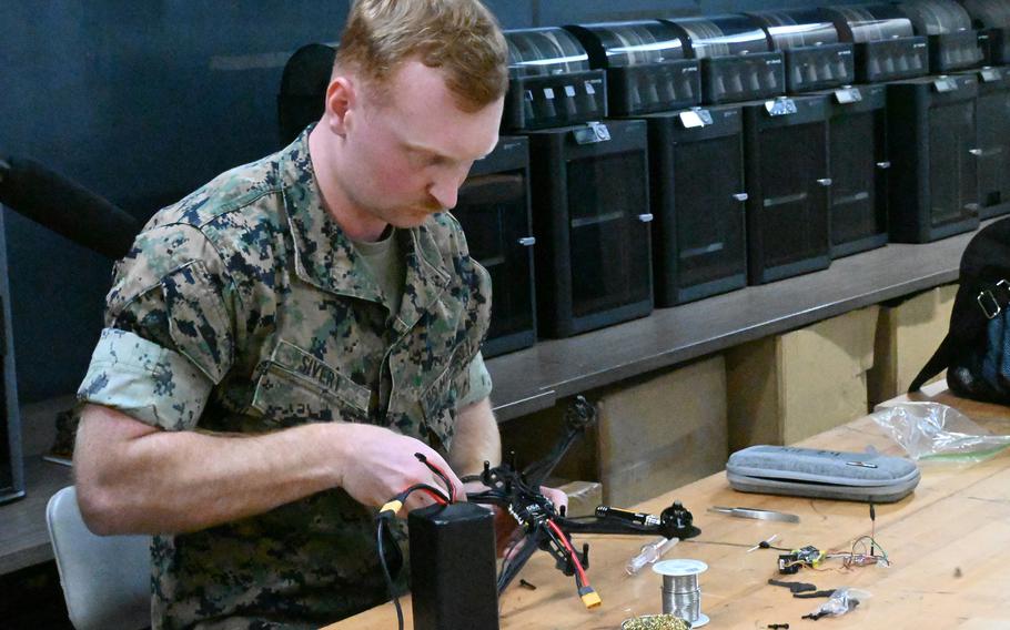 A Marine assembles a training drone.