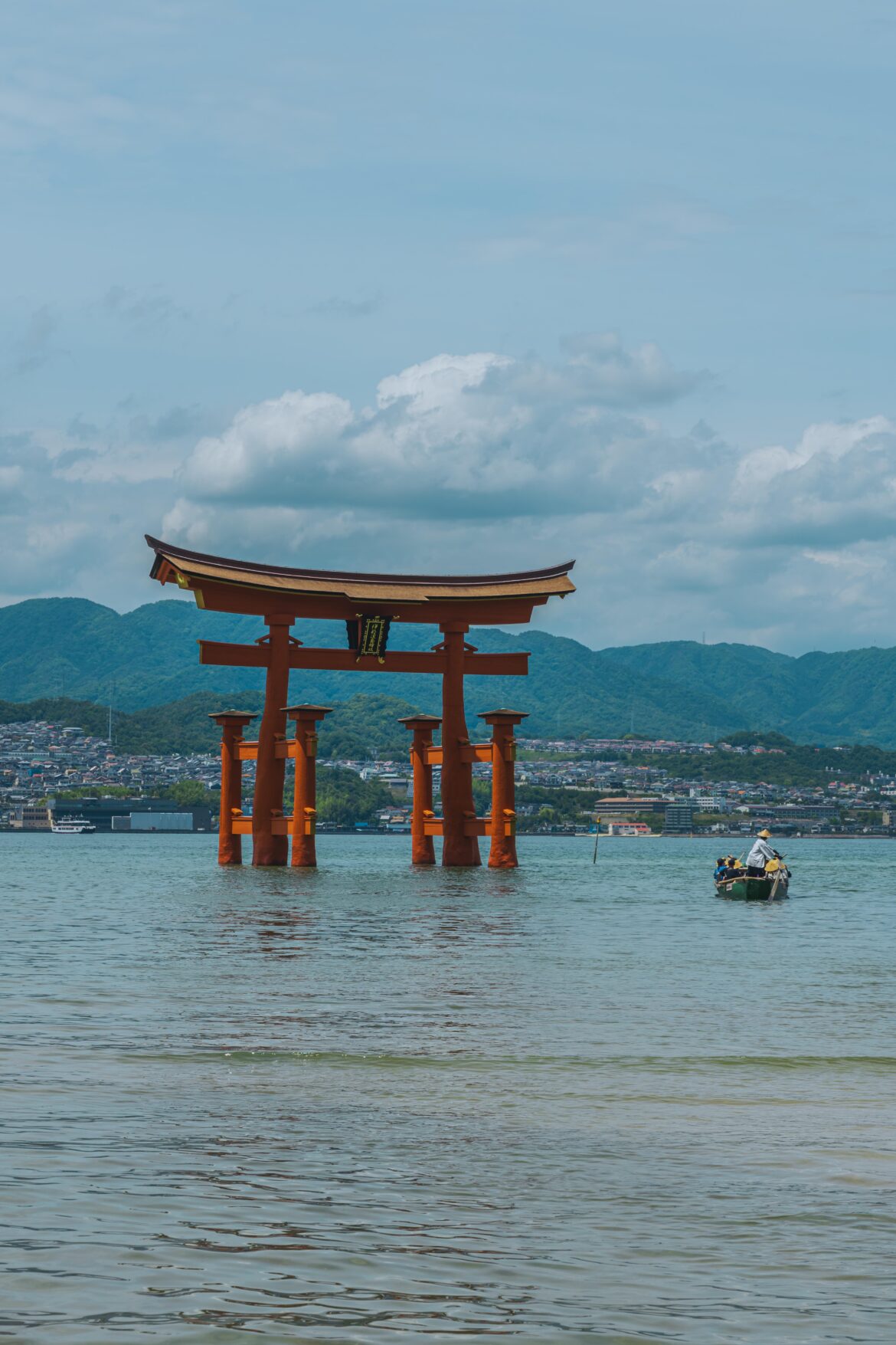 [OC]The floating Torii gate of Itsukushima Shrine and a traditional rowing boat.